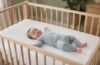 Baby sleeping safely on their back in an empty crib