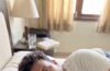 Person resting in bed after a fever