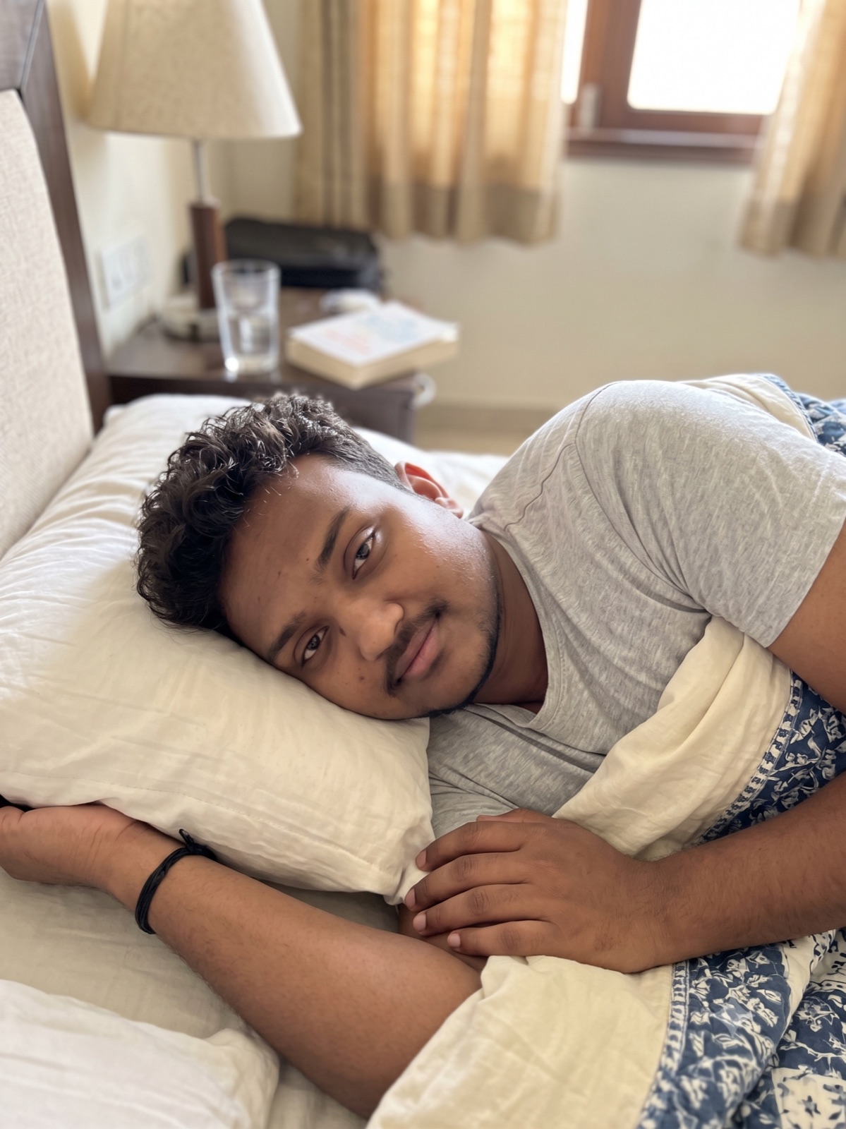 Person resting in bed after a fever