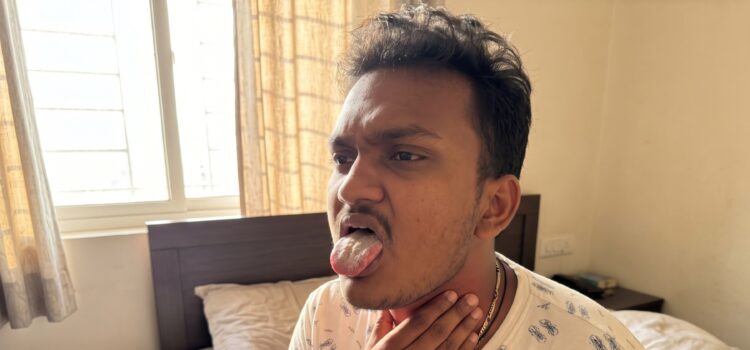Man checking a dry mouth and sore throat after waking