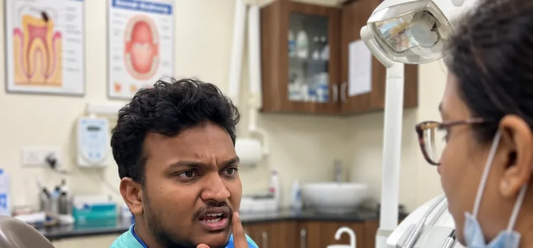 Patient discussing pain and bleeding in one gum spot with a dentist