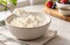 Bowl of cottage cheese showing its soft curds and creamy texture